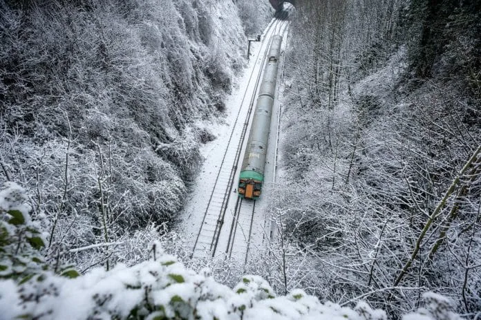 Train carry on running despite the snowfall, in Brighton.